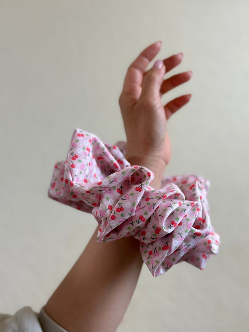 Cherry blossom scrunchie on a hand