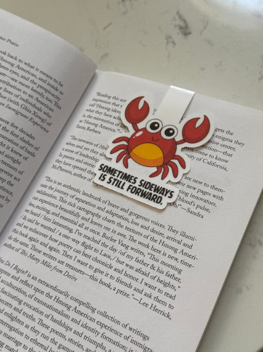 crab sideways forward magnetic bookmark on a book