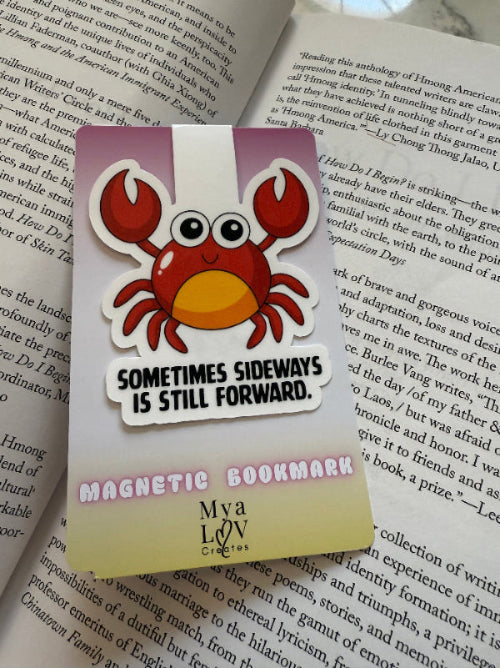 crab sideways forward magnetic bookmark on a book