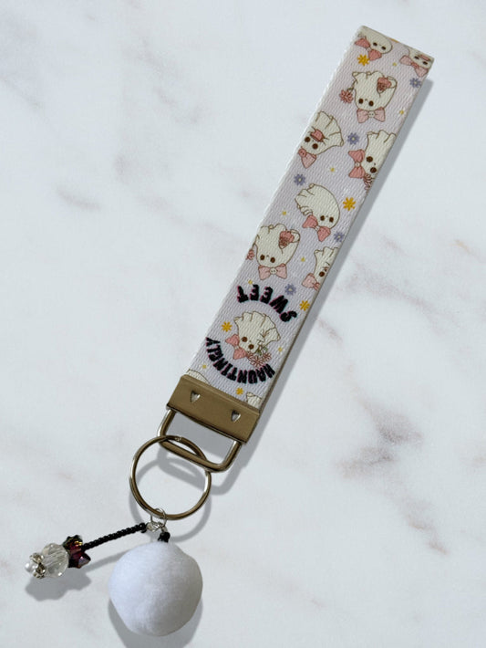 Keychain with cartoon character design on a white background
