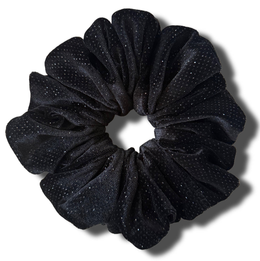 Black glittery scrunchie on a white background