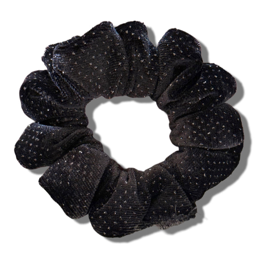 Black glittery scrunchie on a white background
