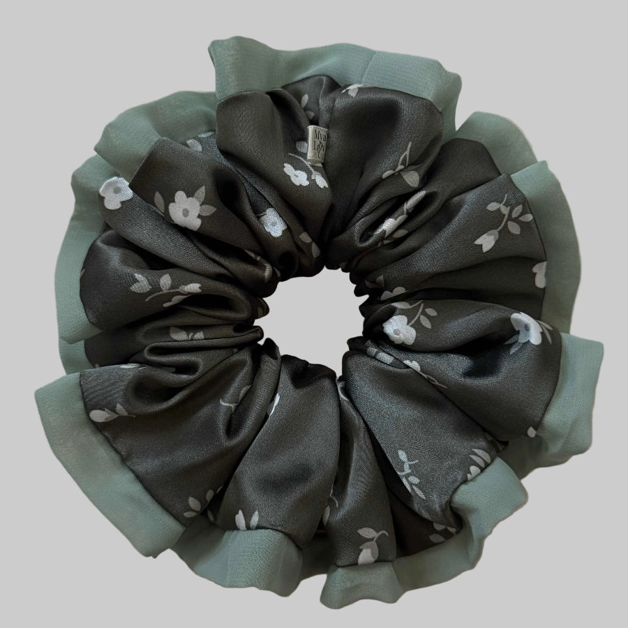 Floral patterned scrunchie on a beige background