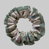 Floral patterned scrunchie on a light background