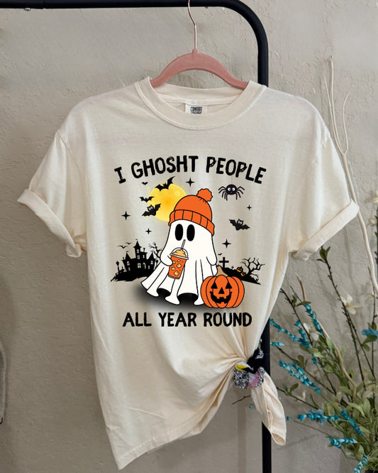 White t-shirt with Halloween-themed design and text on a hanger.