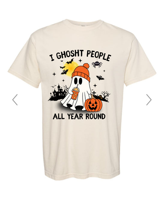 Beige t-shirt with Halloween-themed graphic and text on a white background