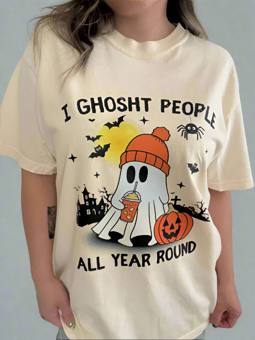 Person wearing a white t-shirt with Halloween-themed design and text.