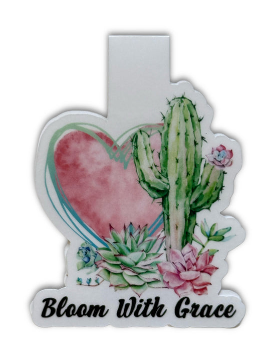 Decorative sticker with cactus, succulents, and heart design with 'Bloom With Grace' text.