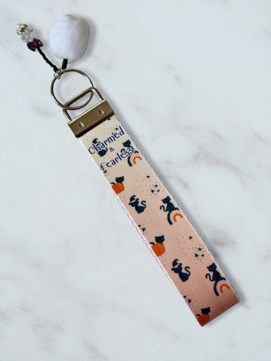 Keychain with cat and moon pattern on a white background