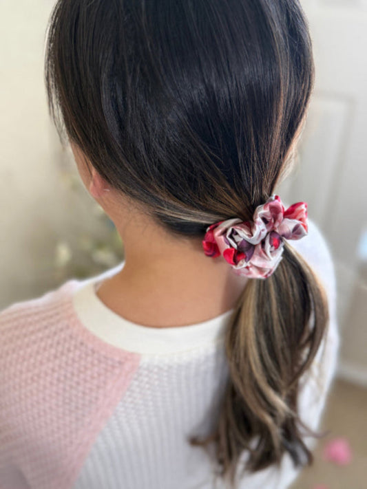 XS satin scrunchie with a bold rose floral print in red, pink, and purple, designed for everyday wear offering a secure and stylish hold.