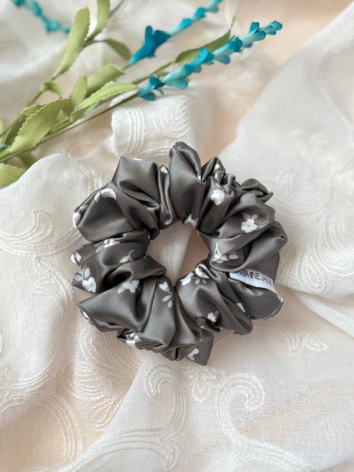 Dark  olive green with white flowers, designed for normal to thick and long hair, offering a secure and stylish hold.