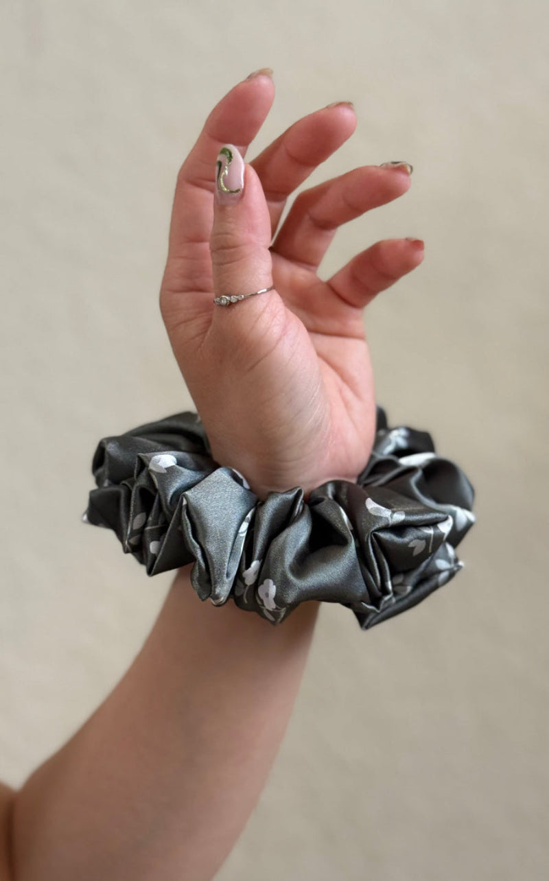 olive green scrunchie on wrist 