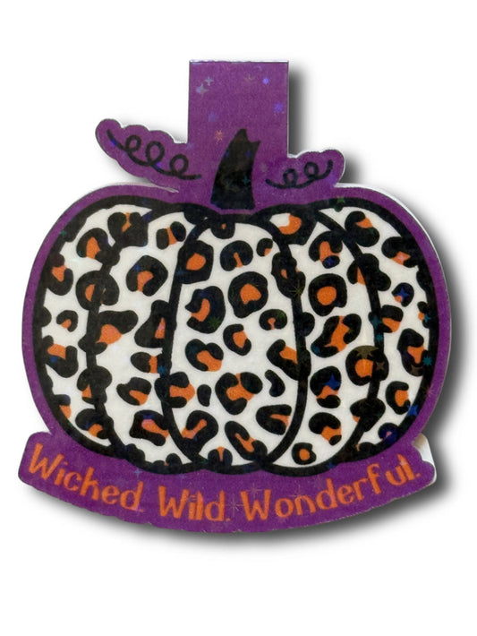 Pumpkin-shaped decorative item with leopard print and 'Wicked Wild Wonderful' text on a white background
