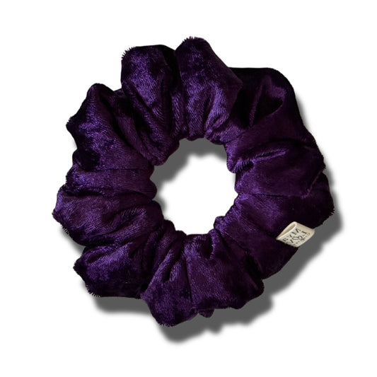 Purple scrunchie on a white background