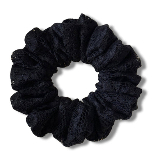 Black scrunchie on a white background