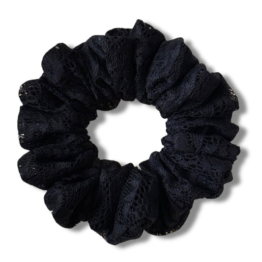 Black scrunchie on a white background
