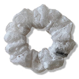 White lace scrunchie on a white background