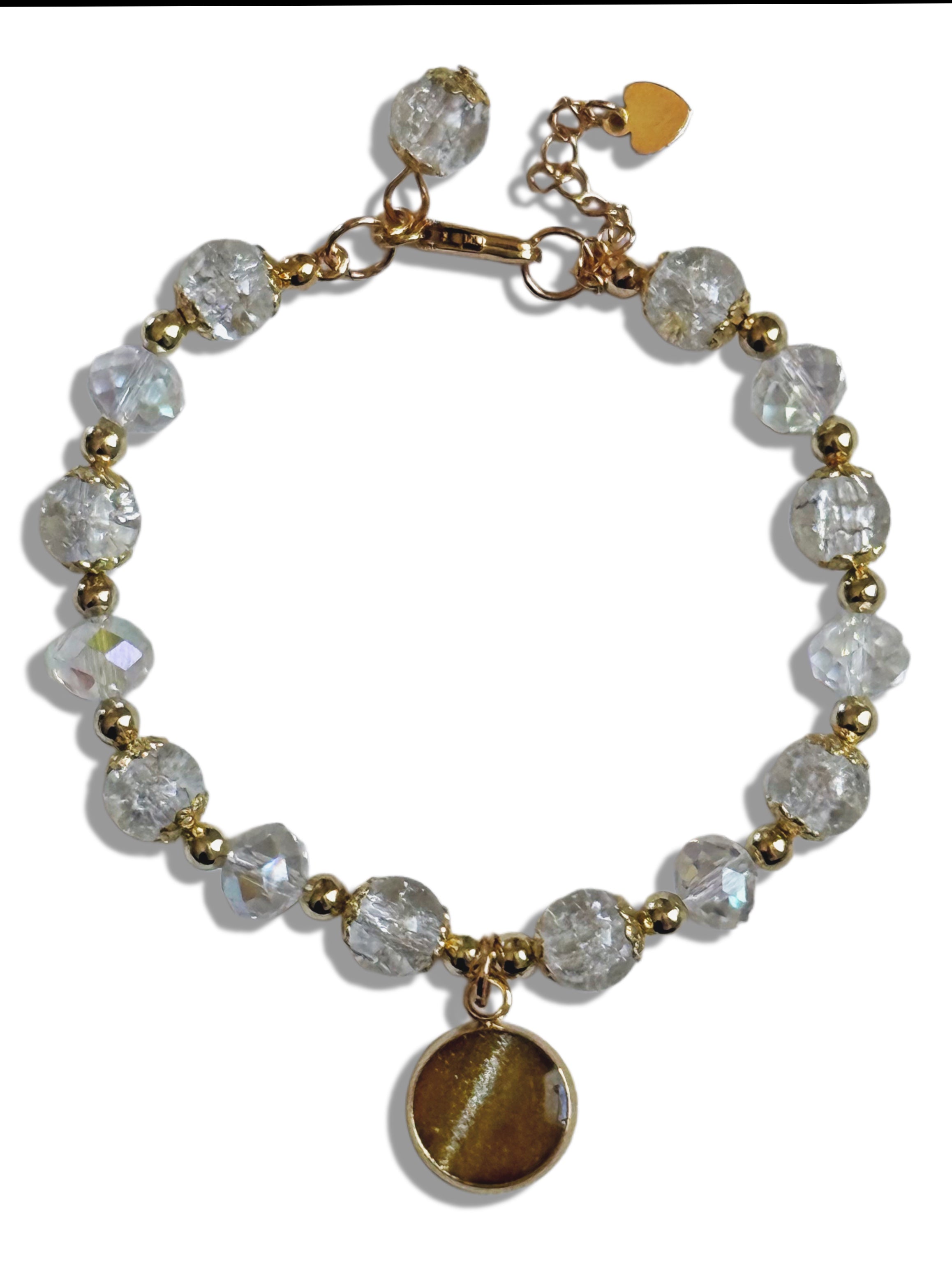 Bracelet with clear beads and gold accents on a white background