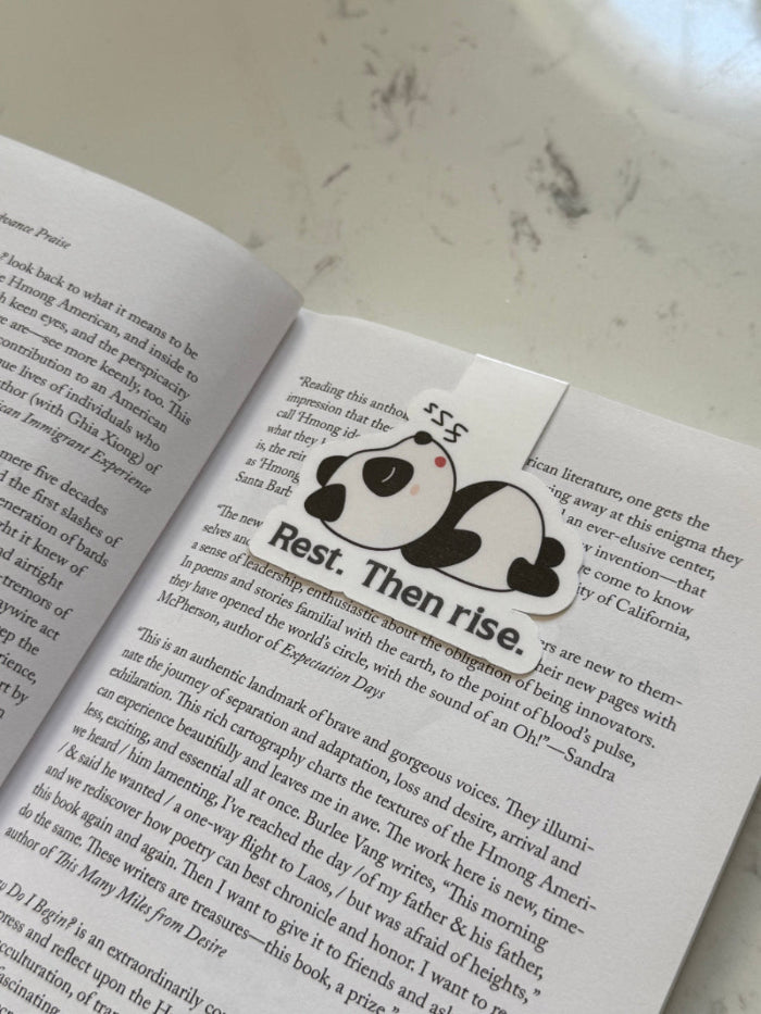 magnetic bookmark  of a panda on a book 