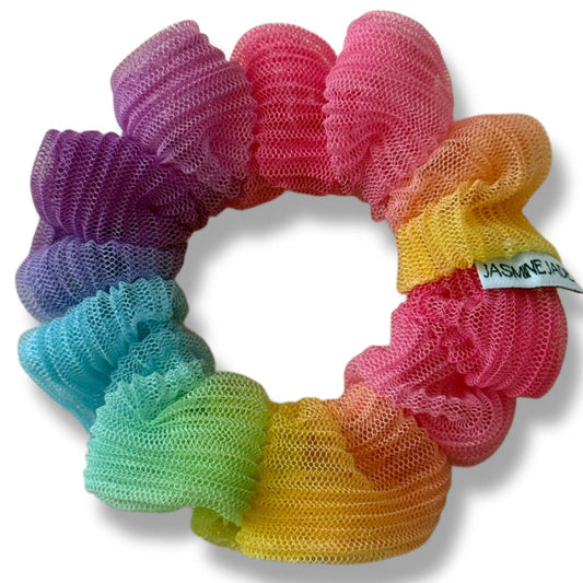 Set of colorful scrunchies arranged in a circular pattern on a white background.