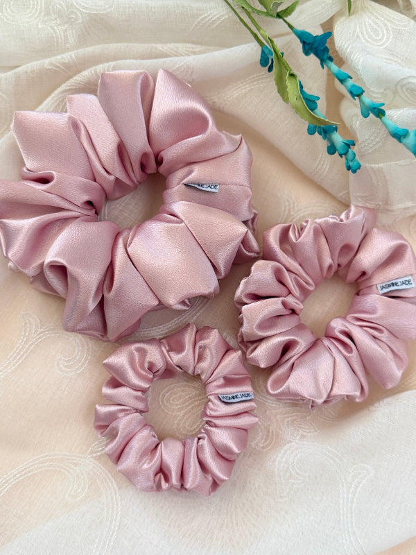 blush satin scrunchie in blush pink, designed for thick,short or fine hair, offering a soft, crease-free, and elegant hold.

