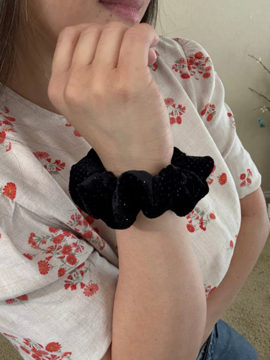 Model wearing Selena XS scrunchie on wrist 