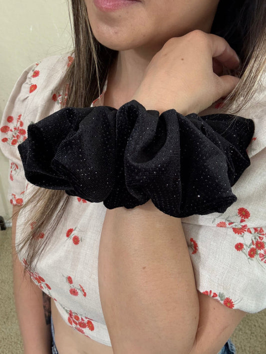 model wearing Starlit velvet xl scrunchie on wrist.