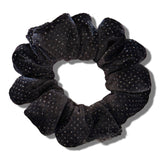 Black glittery scrunchie on a white background