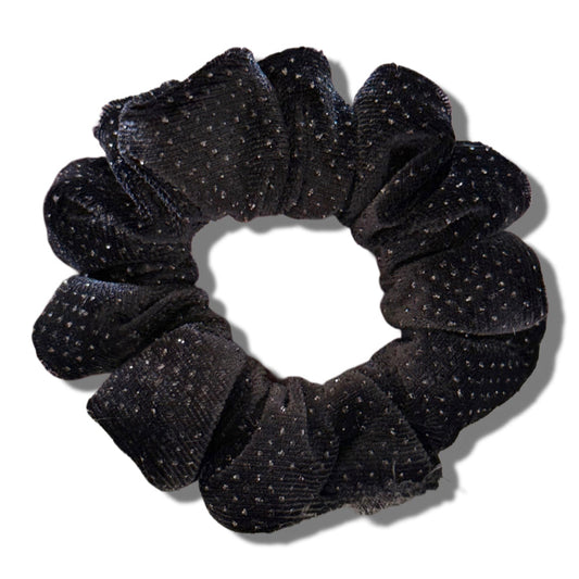Black glittery scrunchie on a white background