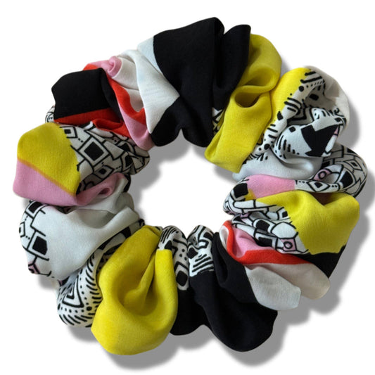 Set of colorful scrunchies with abstract patterns on a white background