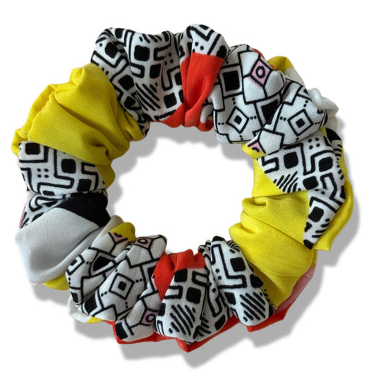 Set of colorful scrunchies with geometric patterns on a white background