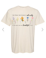 Beige t-shirt with floral design and text on a white background