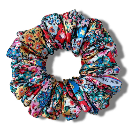 Multicolored floral scrunchie on a white background